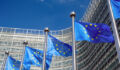 Image of several European Union flags.