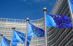 Image of several European Union flags.