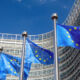 Image of several European Union flags.