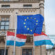 European Union and Luxembourg flags waving in front of the Chamber of Deputies - Luxembourg City, Luxembourg