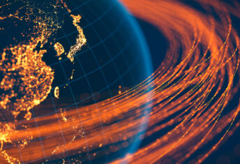 Climate engagement: Systemic stewardship rises up the agenda amid global headwinds Global development capital illustrated by lines of light orbiting the globe